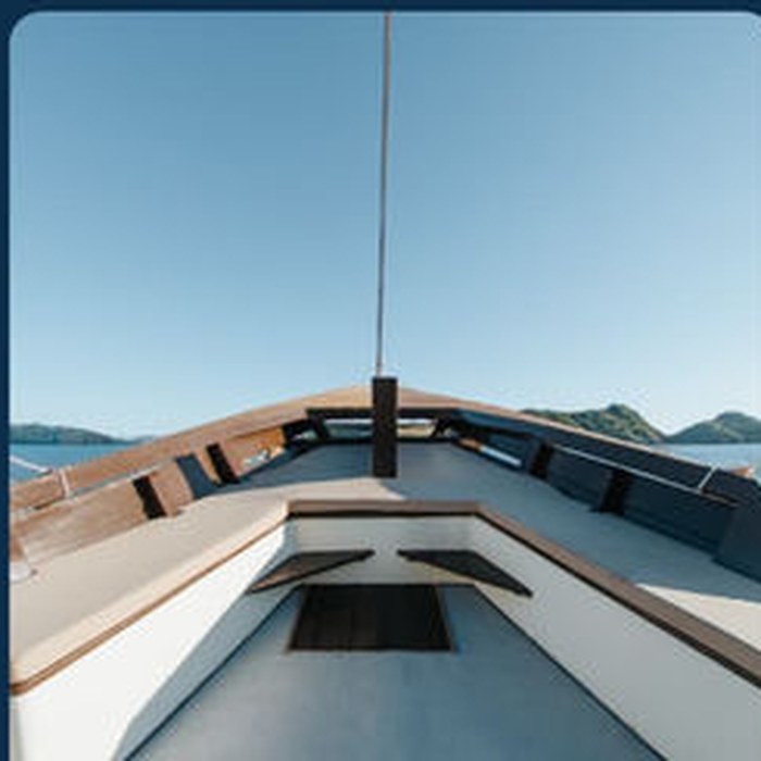 Shaded sun deck with cushioned seating on the KLM New Pandawa