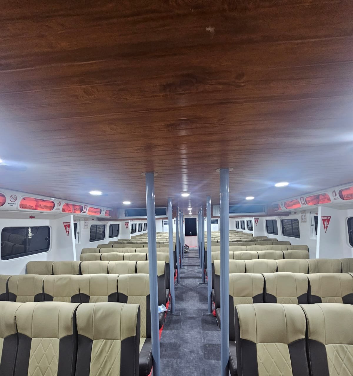Cabin interior with rows of seats — daily fast boat Gili to Padang Bai, Bali