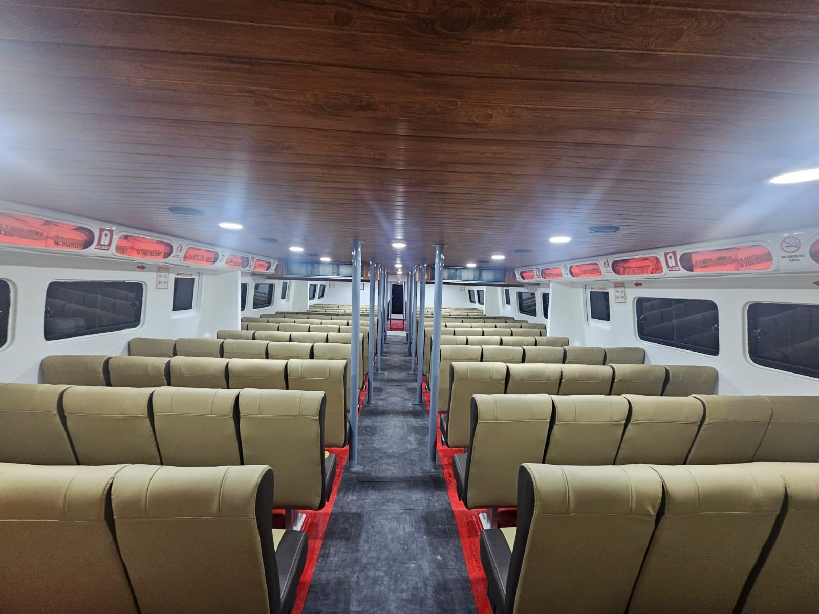 Air-conditioned cabin with cushioned seats — daily fast boat Gili to Padang Bai, Bali